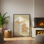 Large framed Michigan county map leaning against a wall beside a fireplace in a cozy living room setting.