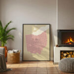 Large framed Ohio map print positioned beside a modern fireplace, adding a warm decorative touch to the cozy living room.