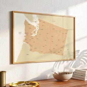 Washington state map print mounted above a wooden console table, illuminated by soft daylight with modern décor elements nearby.